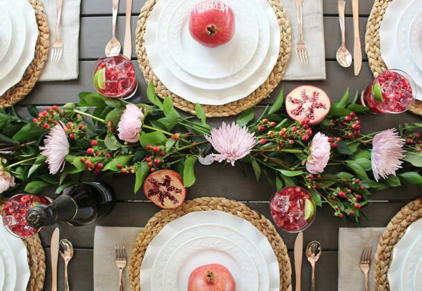 pomegranate inspired tablescape design with fresh floral runner